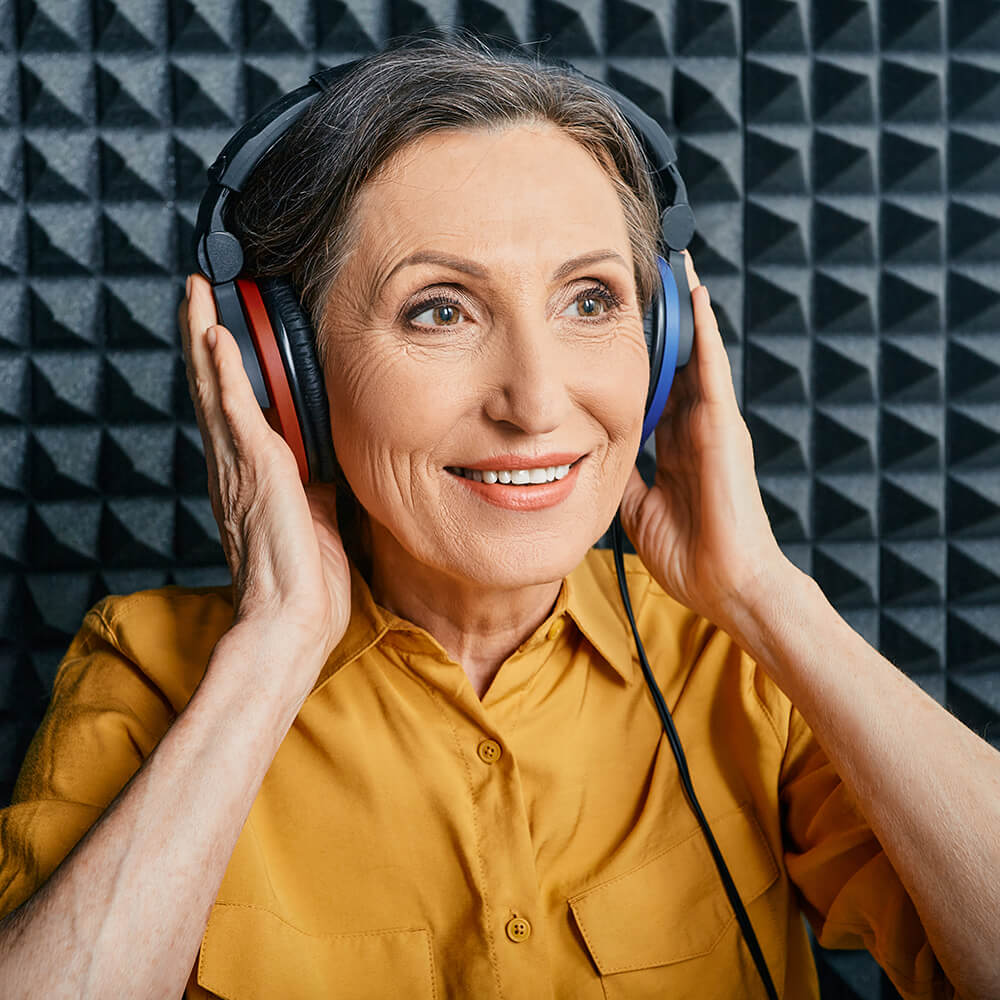 hearing test being done on older woman